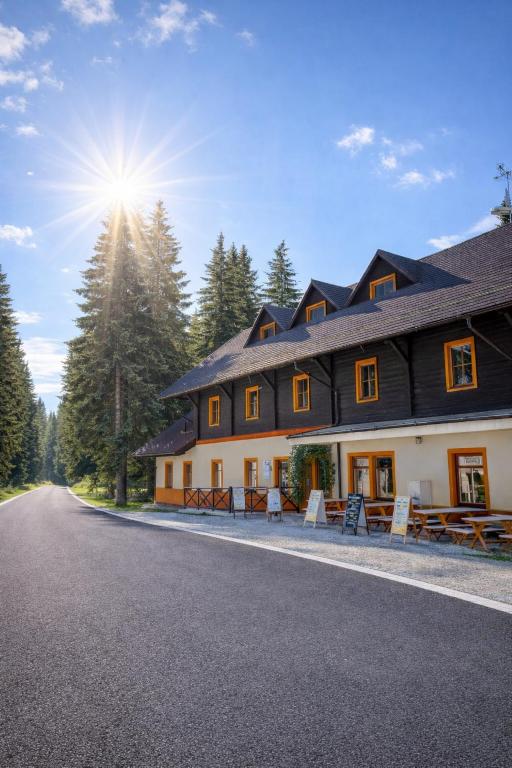 a house on the side of a road at Penzion Pstruh Stožec in Stožec