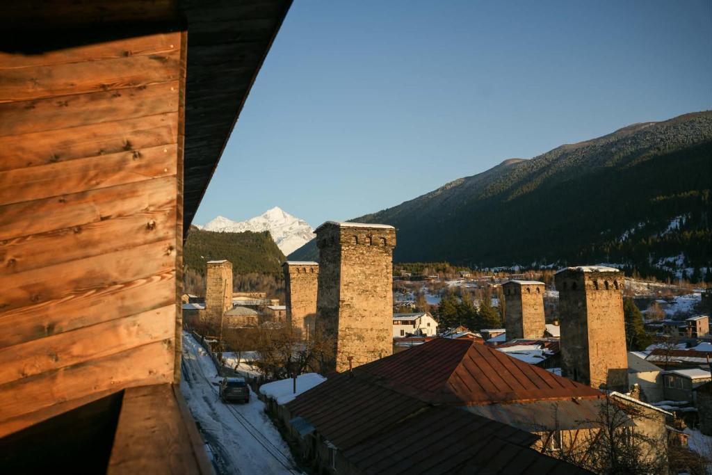 a view of a city with mountains in the background at Lasiim in Mestia