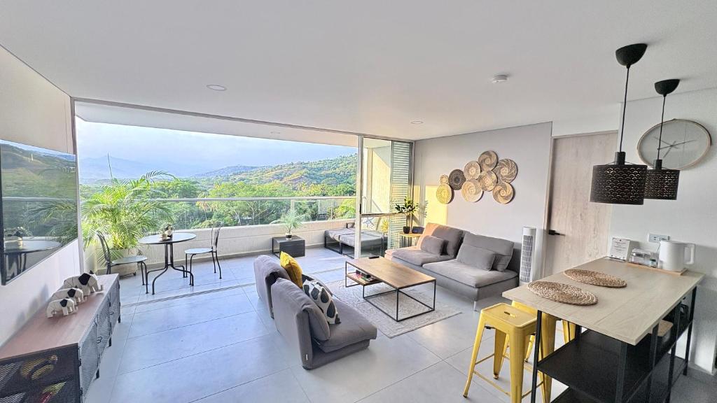 a living room with a view of a living room at Citadela Di Sole Tropical Escape in Santa Fe de Antioquia