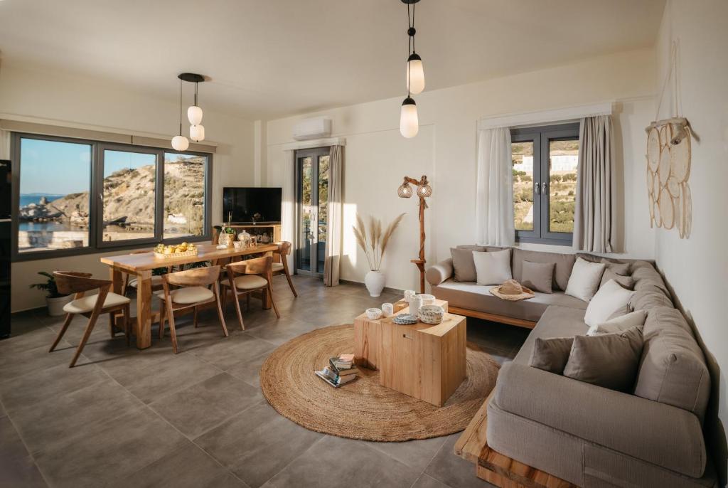a living room with a couch and a table at Irini's Beach House in Ambrami