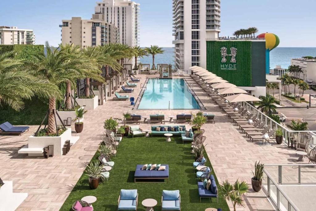 an image of a swimming pool at a resort at 3BR Oceanview HYDE - Free Parking, No Resort Fee in Hollywood
