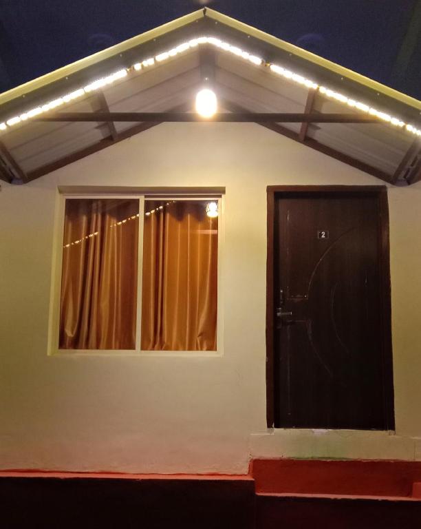 a house with a window and a door at Mountain View Cottage Shivpuri Rishikesh in Rishīkesh
