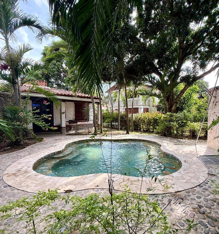 a small pool in the middle of a yard at El Encanto in Olaya
