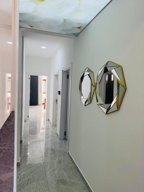 a hallway with a mirror on a wall at Giannas stays 3B in Mombasa