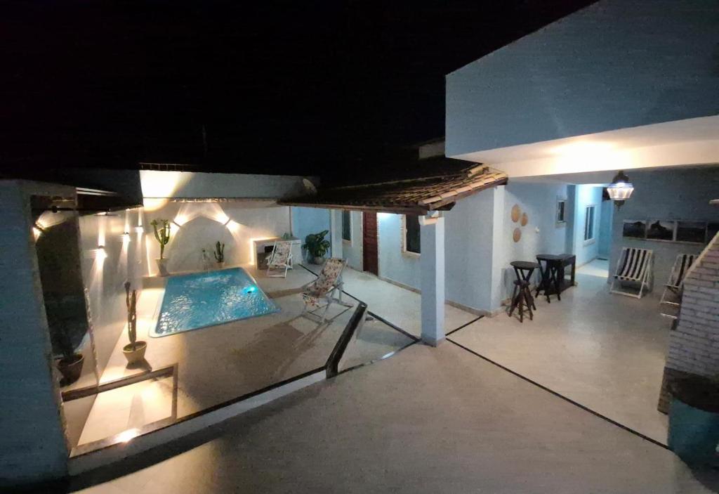 an overhead view of a house with a swimming pool at Luz Residence beach house in Cabo Frio