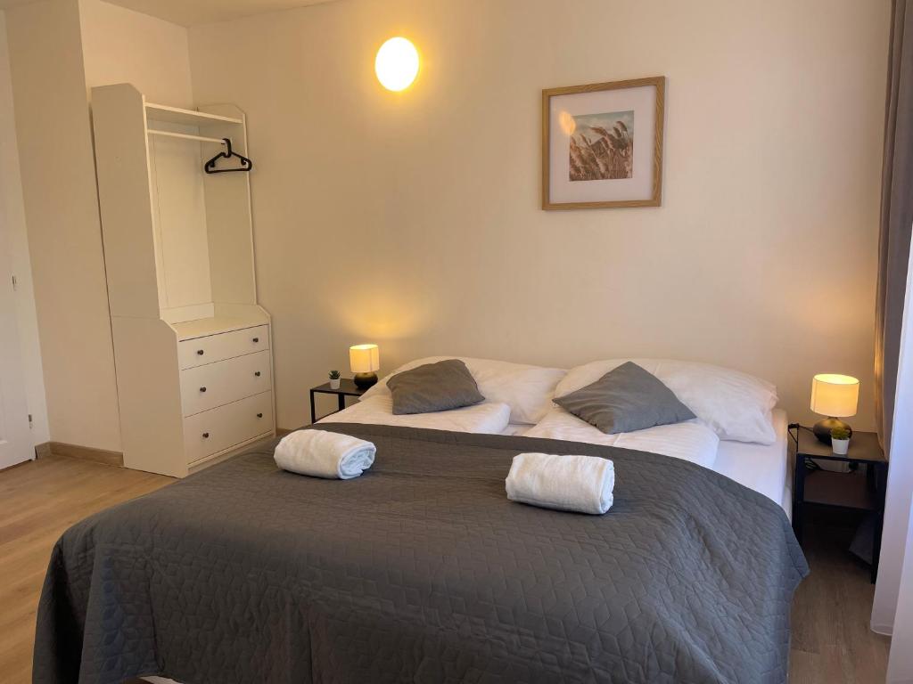 a bedroom with two beds with towels on them at Penzion Vejprty in Vejprty