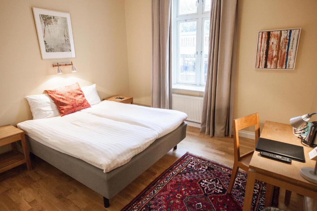 Postel nebo postele na pokoji v ubytování Hotel Bishops Arms Lund