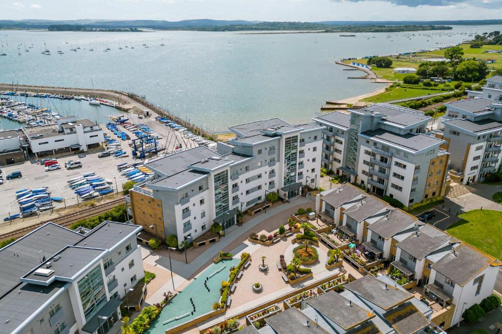 an aerial view of a city with a marina at Ocean Breeze - Stunning Harbour Views from Private Balcony in Poole