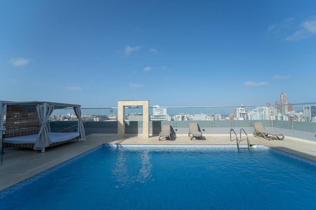 a swimming pool on the roof of a building at Radisson Diamond Barranquilla in Barranquilla