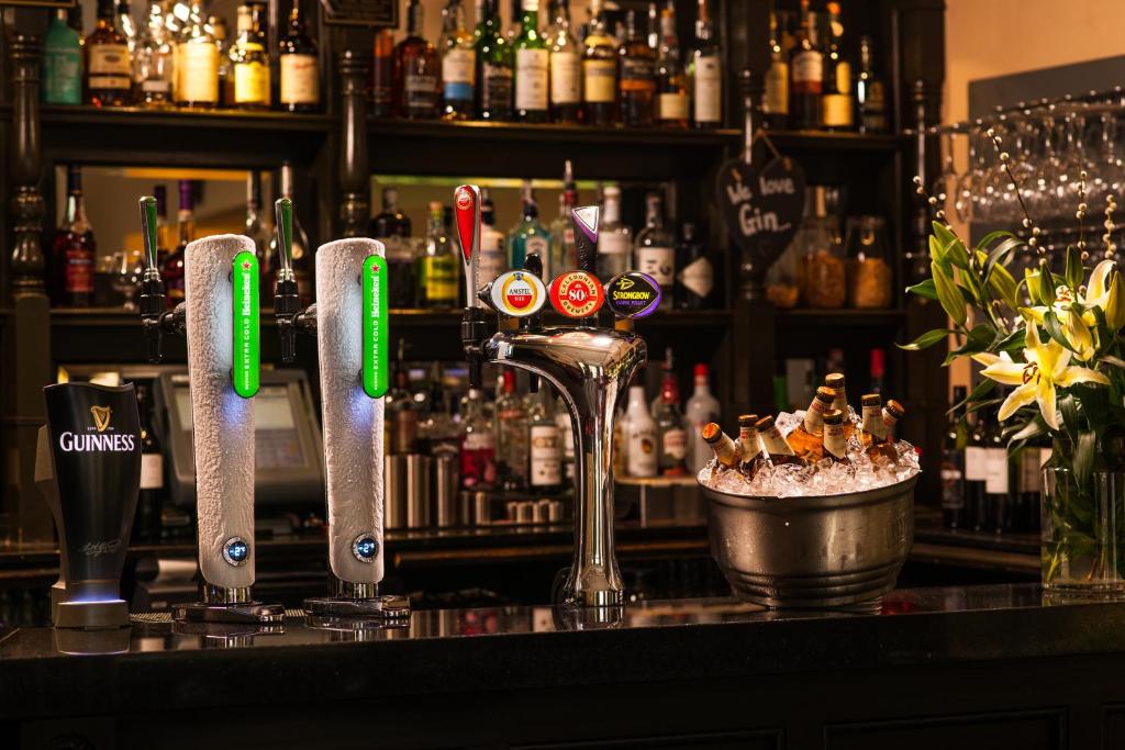 a bar with a martini glass on a counter at Leonardo Boutique Huntingtower Perth in Perth