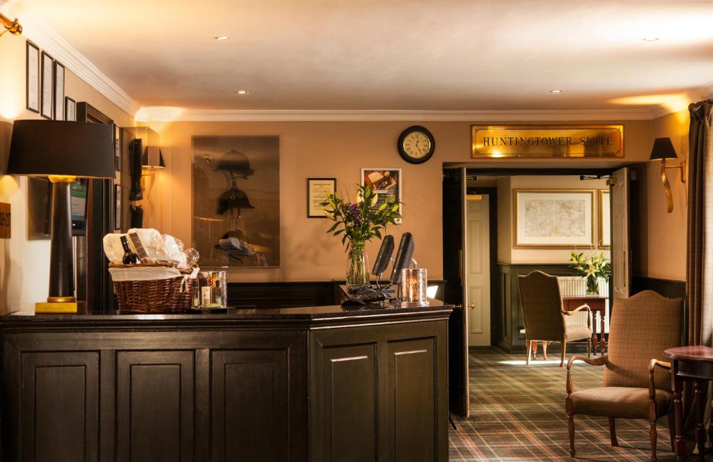 a kitchen with a counter and a dining room at Leonardo Boutique Huntingtower Perth in Perth