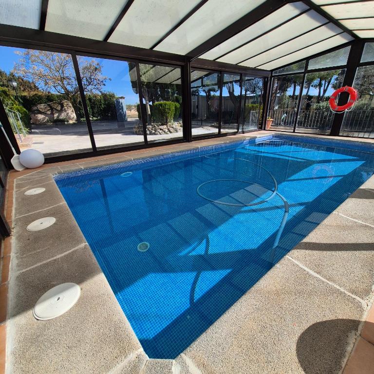 a swimming pool in a house at Finca Don Sancho by Mayne in Lillo