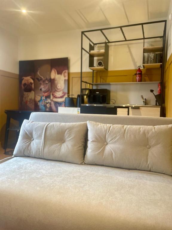 a bed with white pillows in a room at Dublin City Centre Holiday Let in Dublin