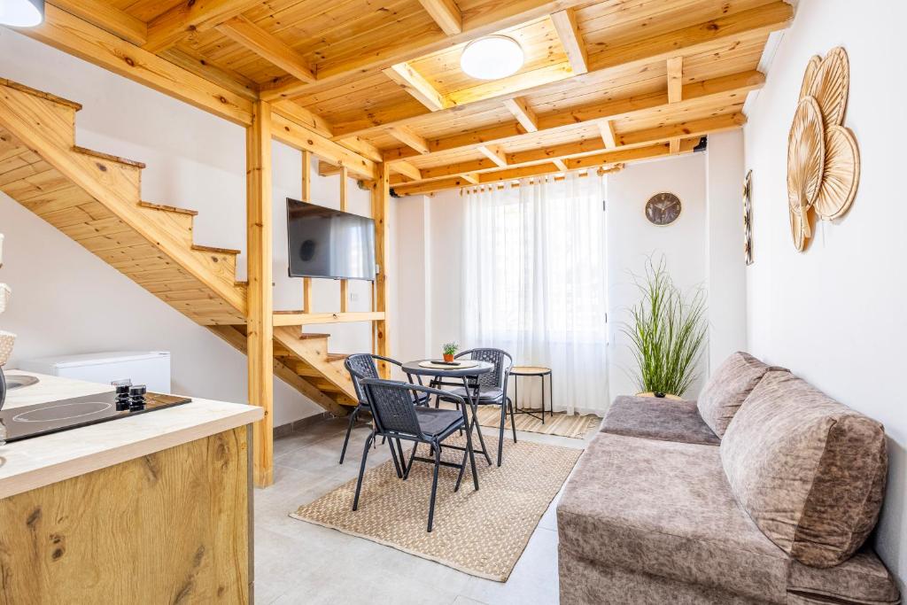 a living room with a couch and a table at Lalun Aparts in Golem