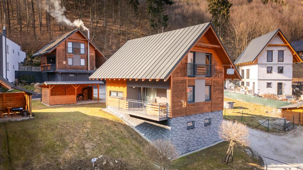 an overhead view of a house with a metal roof at Chata Majocka Martin Strane, Ferrata in Martin