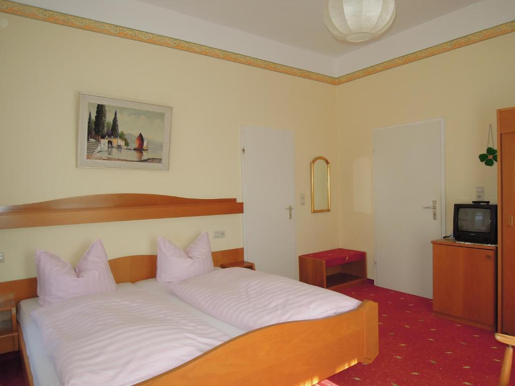 Postel nebo postele na pokoji v ubytování Hotel Fidelitas