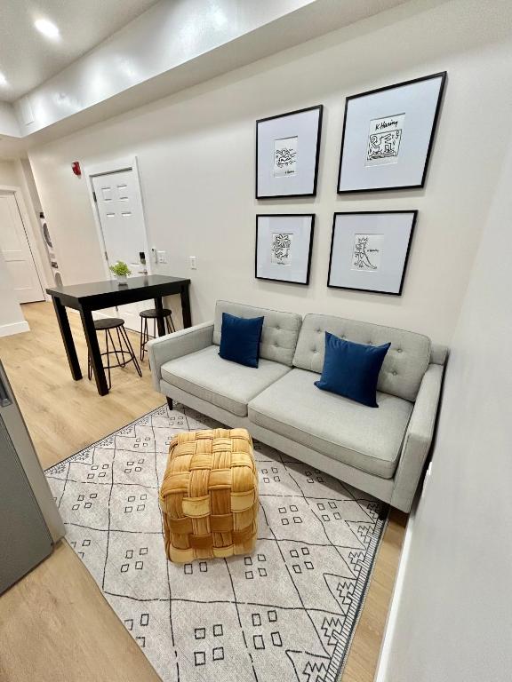 a living room with a couch and a table at 241- Convenient City Stay in Hoboken