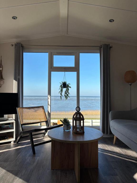 a living room with a view of the ocean at Noa aan Zee in Westerland