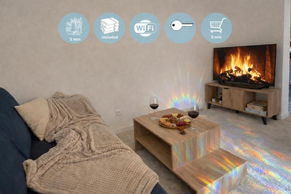a living room with a couch and a fireplace at Le Loft d'Azur - Cozy - Netflix in Fontainebleau