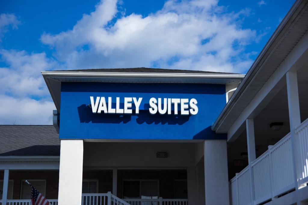 a view of a valley suites sign on a building at Valley Suites Extended Stay Hotel in Harrisonburg