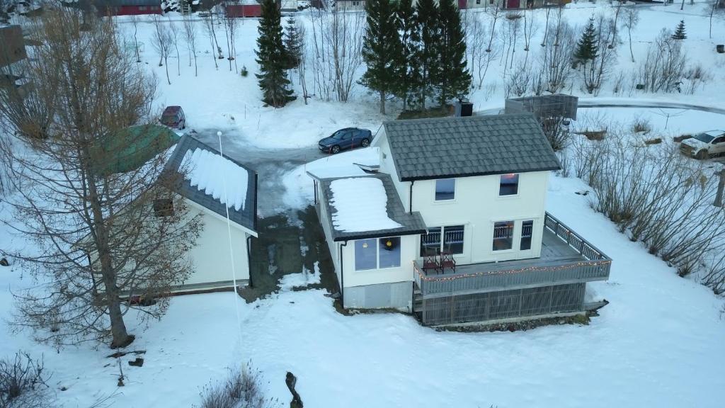 an aerial view of a house in the snow at Northbound Sea View Retreat in Sortland