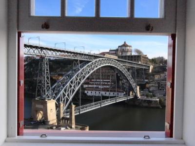 a view of a bridge from a window at Porto Riverside in Porto