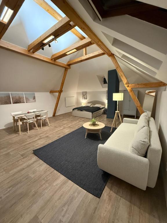 a living room with a couch and a table at Apartmán 19 in Mikulov