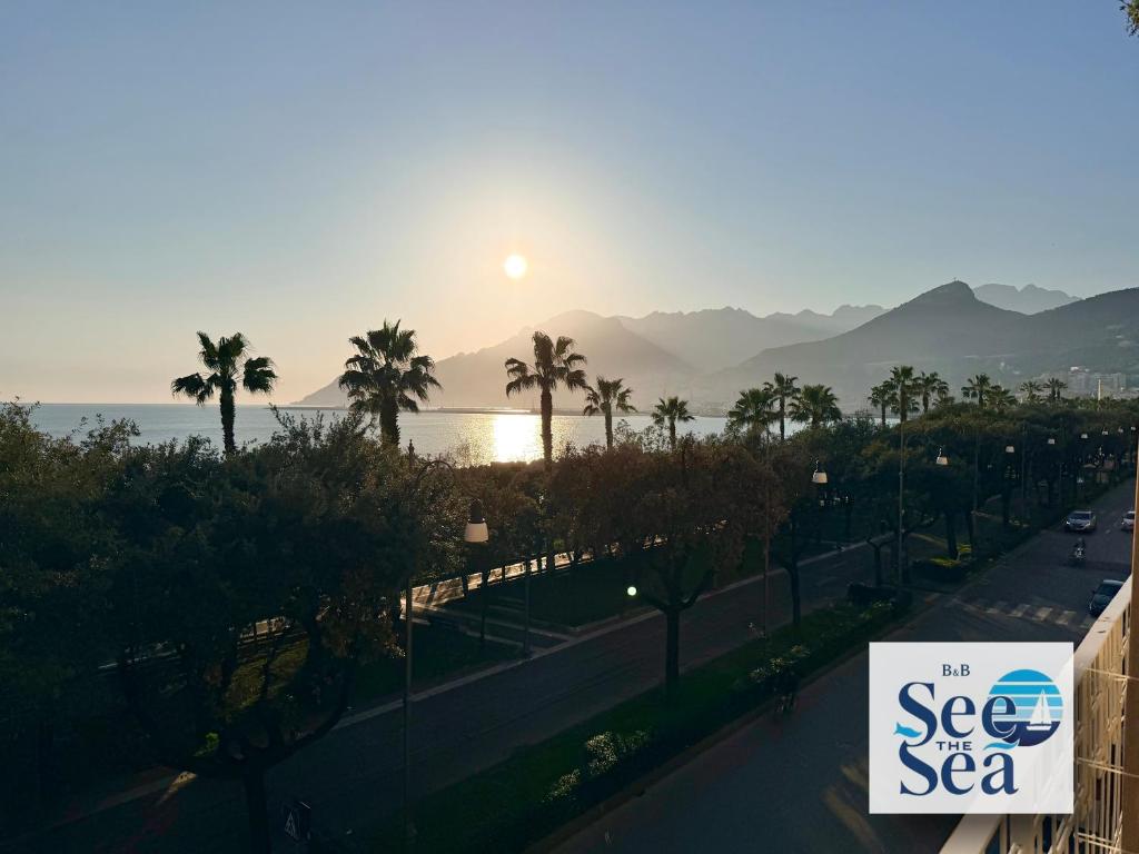 a sign that says see the sea with the sun in the background at See The Sea B&B in Salerno
