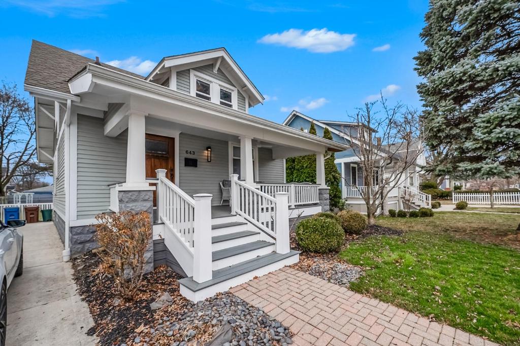 a house with a white porch and stairs at Steps to Dtwn Plymouth! Home w/ Dog-Friendly Yard in Plymouth