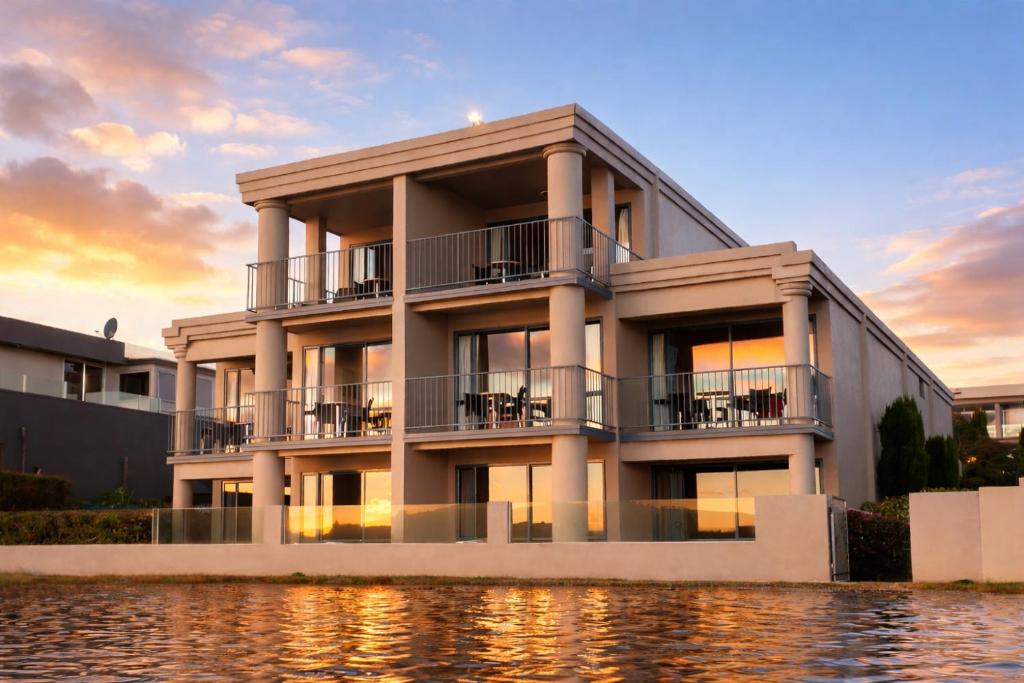 a building with water in front of it at Boulevard Waters in Taupo