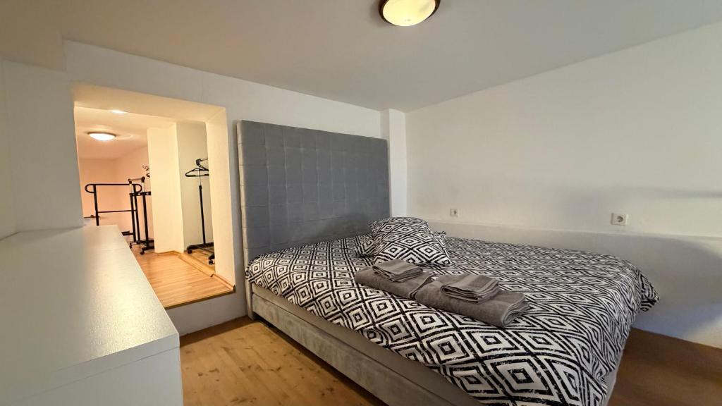 a bedroom with a bed with a purse on it at Loft in Viljandi Old Town in Viljandi
