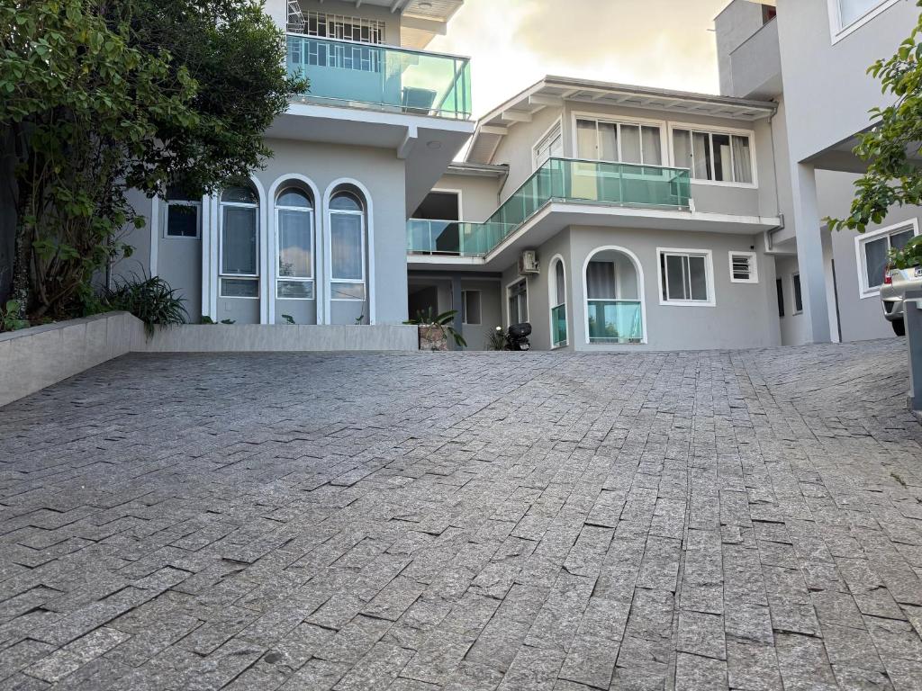 a house with a driveway in front of it at Private Suite Confortable Stay in Florianópolis