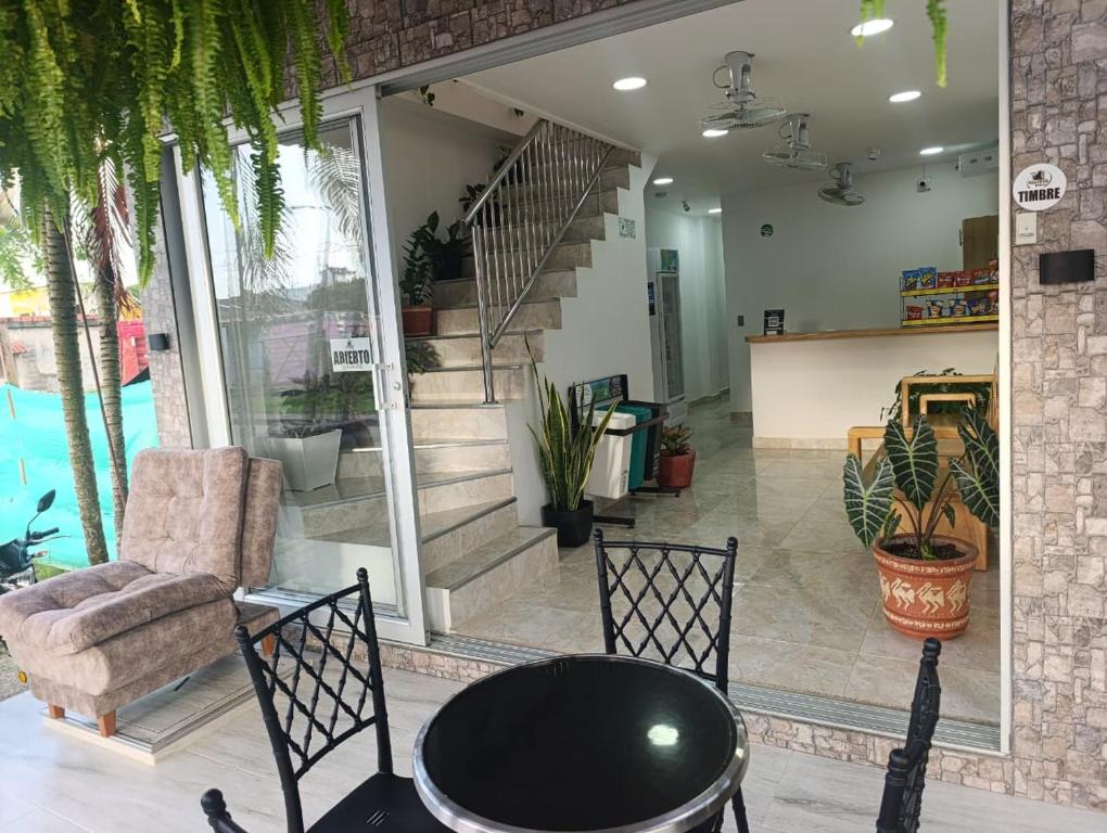 a living room with a couch and a table and chairs at Hotel Panther Resort in Necoclí
