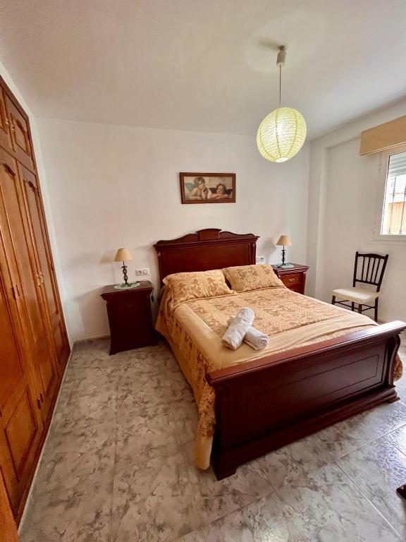 a bedroom with a bed with a teddy bear on it at Casa Vista Hermosa Rute in Rute