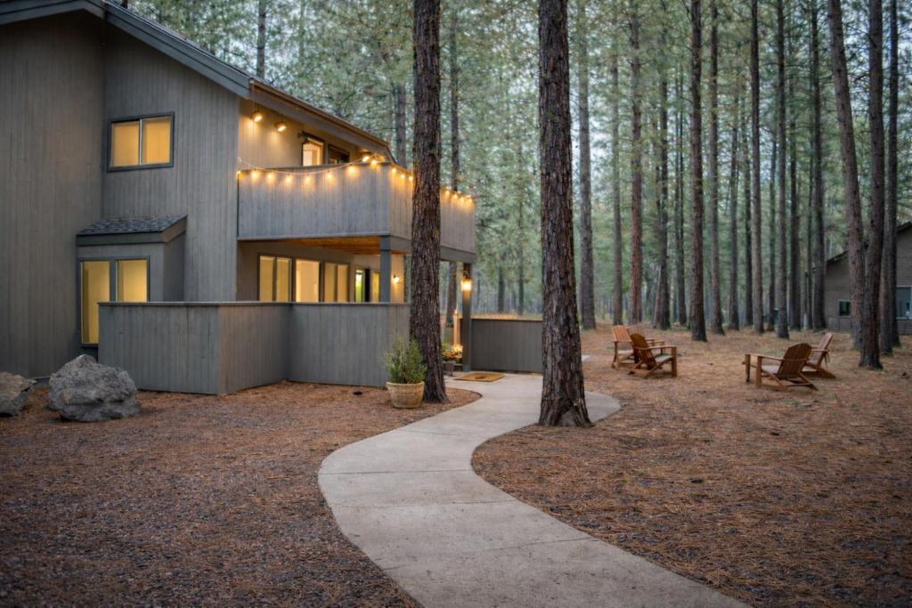a house in the woods with lights on it at Glaze Meadow 129 in Redmond