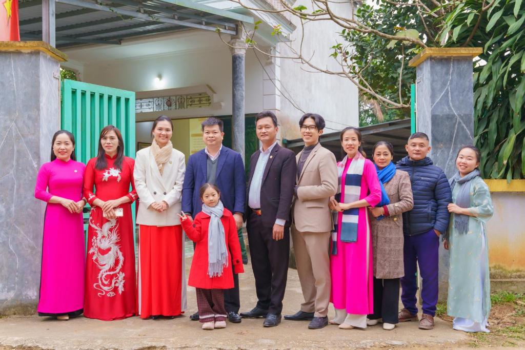 a group of people posing for a picture at Đức Tới Farmstay in Ho Tô