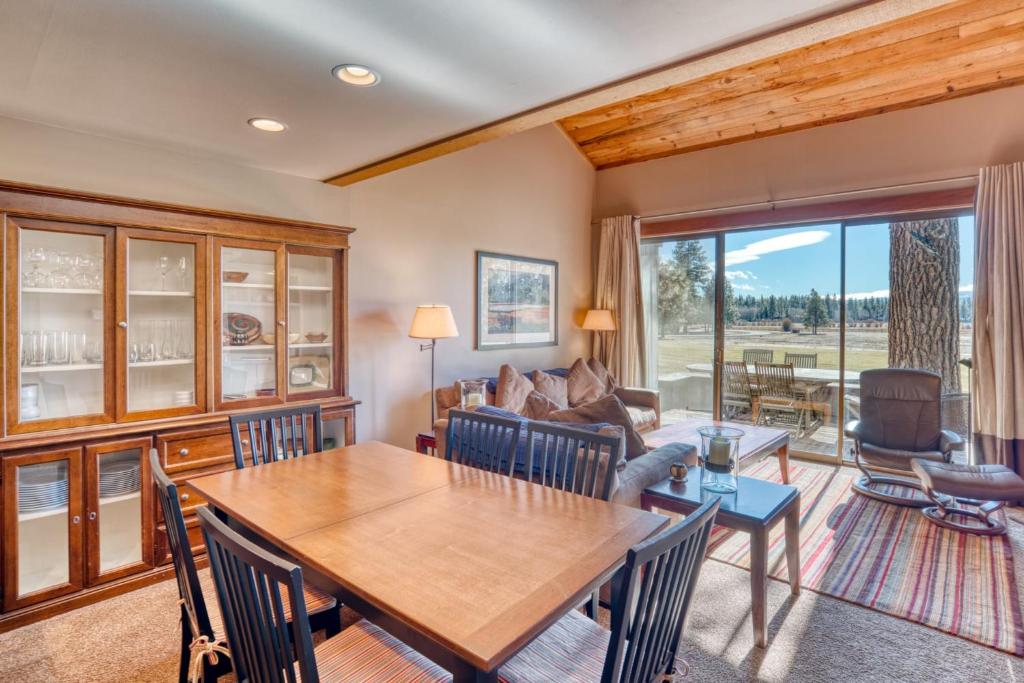 a living room with a wooden table and chairs at Lodge Condo 022 in Black Butte Ranch