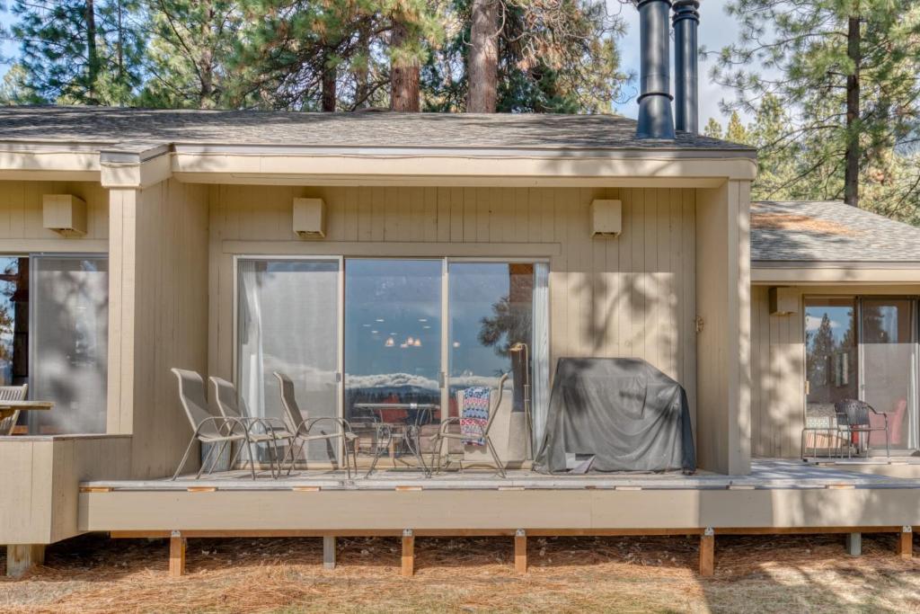 a screened in porch of a house with chairs at Lodge Condo 021 in Black Butte Ranch