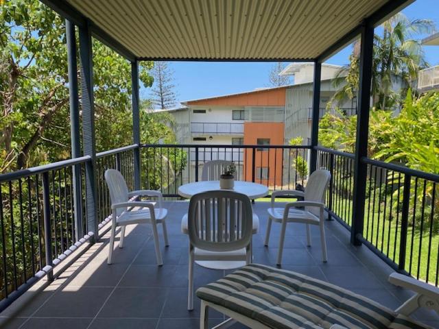 a patio with a table and chairs on a balcony at Alstan 3 Bedroom Beach House in Coolum Beach