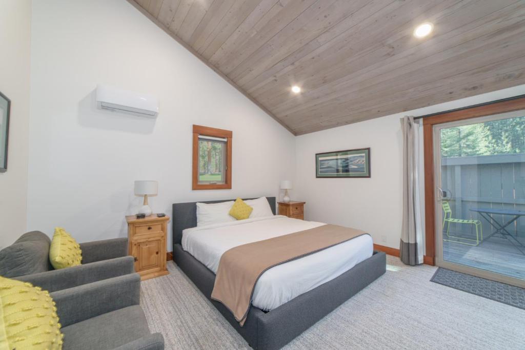 a bedroom with a bed and a couch at Lodge Room 019 in Black Butte Ranch