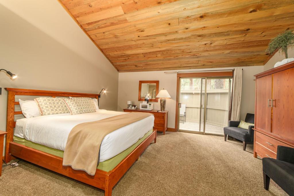 a bedroom with a bed and a wooden ceiling at Lodge Room 024 in Black Butte Ranch