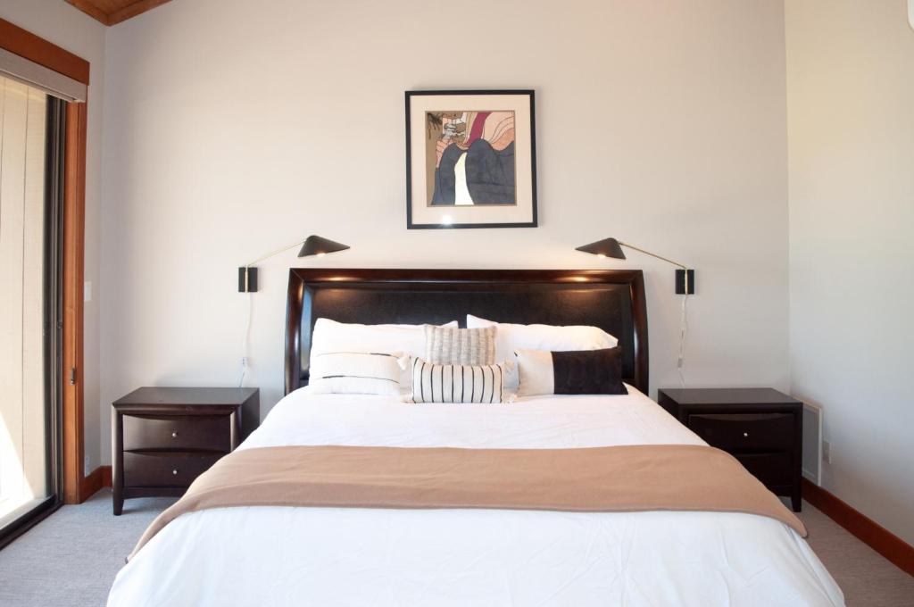 a bedroom with a large bed with two night stands at Lodge Room 015 in Black Butte Ranch