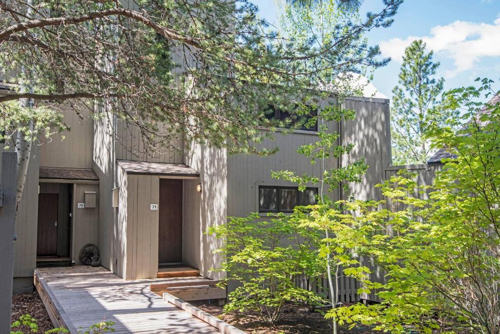an exterior view of a building with trees at Country House 071 in Black Butte Ranch