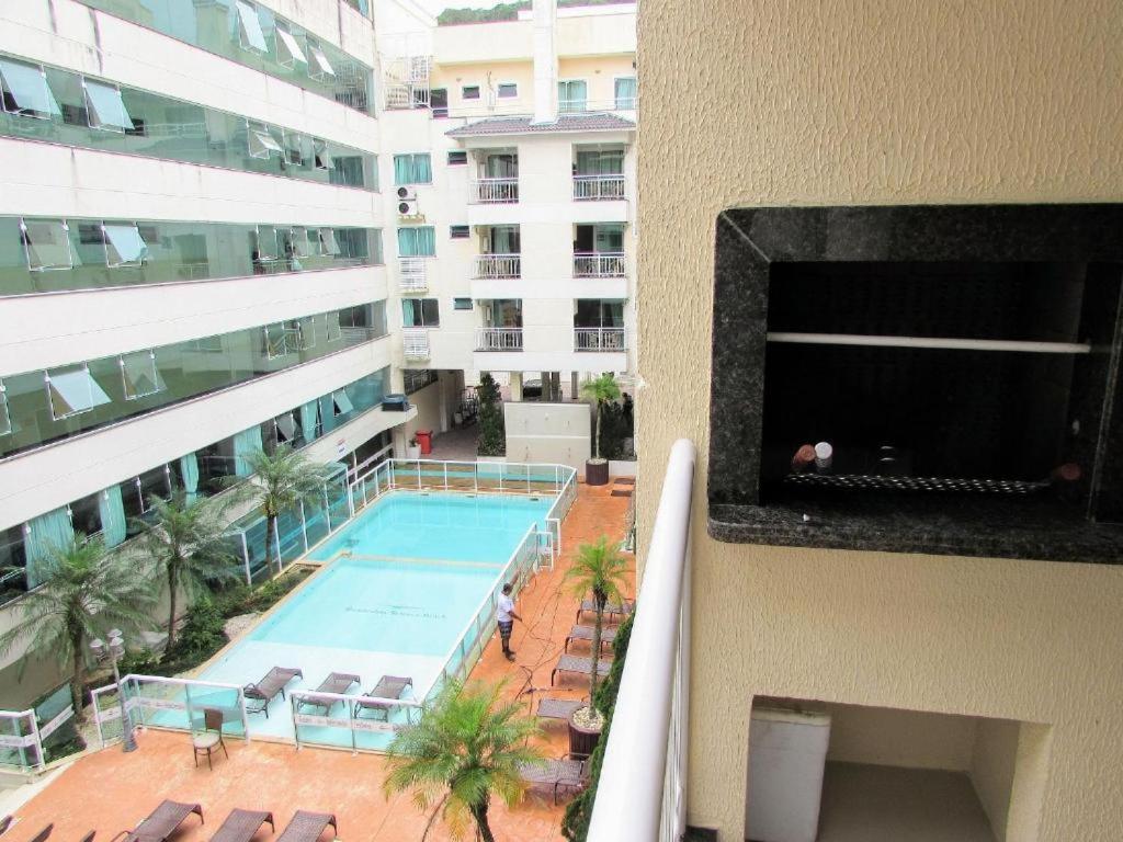 an overhead view of a swimming pool in a building at Bombinhas summer bech in Bombinhas