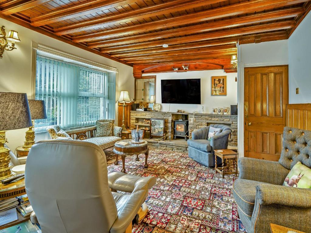 a living room filled with furniture and a tv at Steppe Haugh in Hawes