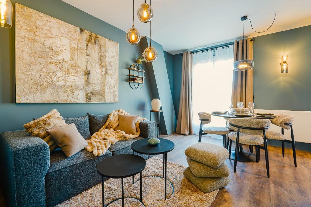 a living room with a couch and a table at Maison Kolsaas in Vernon