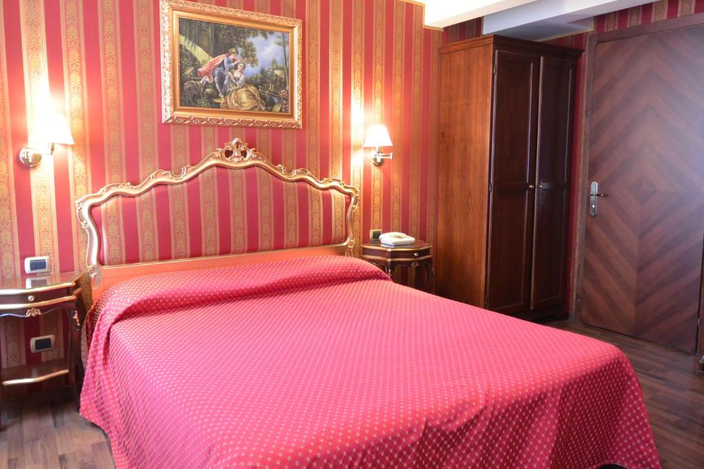 Postel nebo postele na pokoji v ubytování Hotel Città Di Milano
