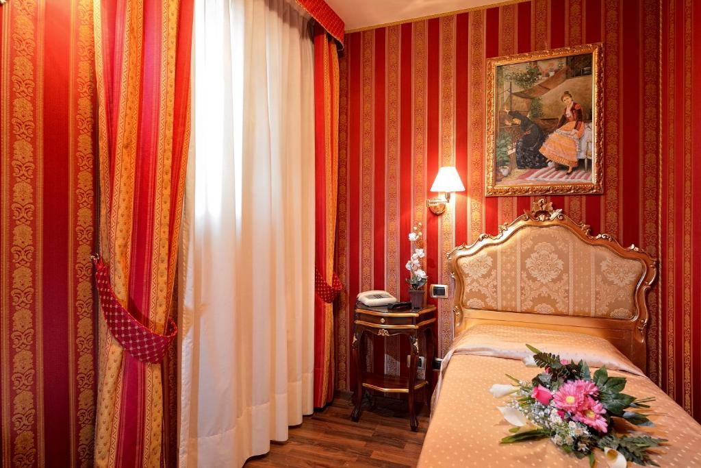 Postel nebo postele na pokoji v ubytování Hotel Città Di Milano