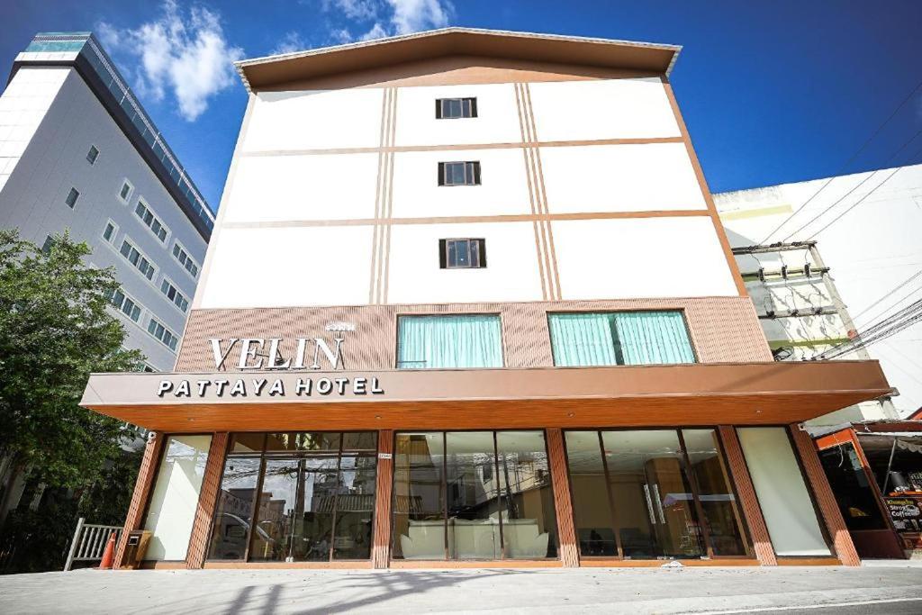 a building with a sign that reads vitamin patania hotel at VELIN Pattaya Hotel in Pattaya