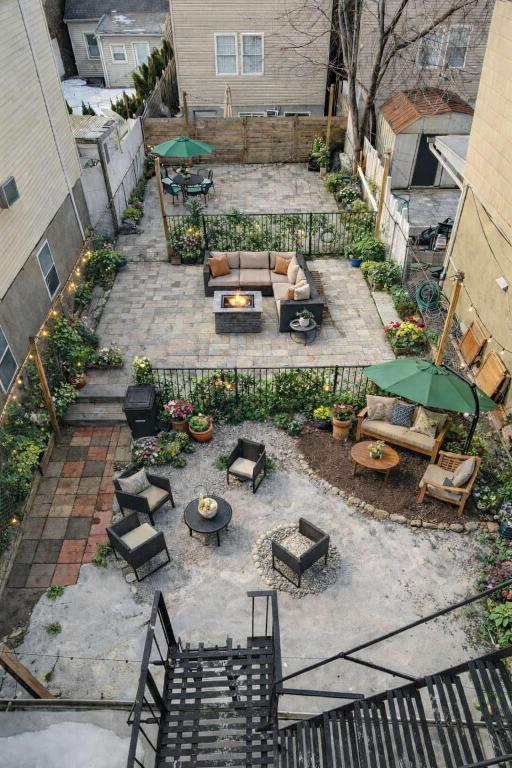 an overhead view of a patio with furniture and tables at Jefferson Sr - 20 mins to Manhattan, NYC in West New York
